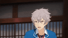 a boy with gray hair is wearing a blue uniform