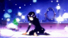 a girl in a black dress is kneeling on a bed in front of a mirror