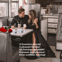 a picture of a man and woman sitting at a table with a pleasant sunday caption