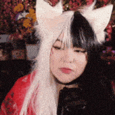 a woman wearing a black and white cat costume