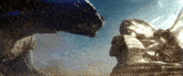 two monsters are standing next to each other in front of a sphinx