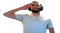 a man wearing a white shirt that says huntington salutes