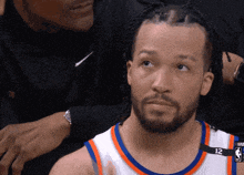a basketball player wearing a number 12 jersey