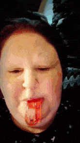 a girl with a red tongue sticking out is making a funny face