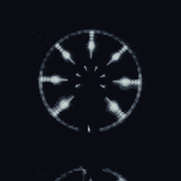 a circle with a clock face in the middle
