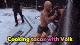 two men are fighting in a boxing ring with the words cooking tacos with volk above them
