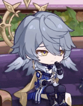 a cartoon character with wings is sitting on a couch and looking at something .