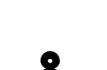 a black object with a hole in the middle is floating in the air on a white surface .