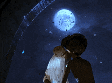 a couple of cartoon characters looking at a full moon