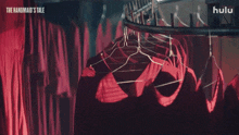 the handmaid 's tale is shown on hulu in a dark room
