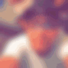 a blurred image of a person 's face with a purple background