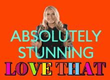 a woman is standing in front of a sign that says absolutely stunning love that