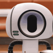 a close up of a robot with a circle on its head
