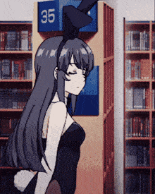 a girl in a bunny costume is in front of a sign that says 35
