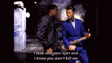 a man in a blue suit holds a saxophone next to a man in a black jacket