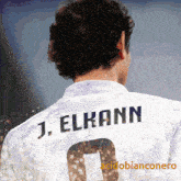 j. elkann is the name on the back of this soccer player 's shirt