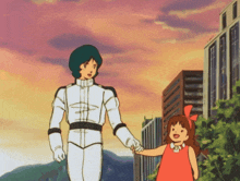 a man in a white suit holds the hand of a little girl