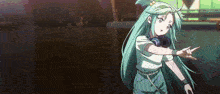 a girl with long green hair is wearing headphones and making a rock sign