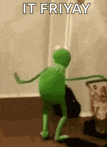 a green kermit the frog is dancing in a room with the words `` it fri yay '' written on it .