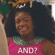 a woman with curly hair is wearing a pink dress and earrings and says and