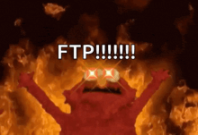 elmo is standing in front of a fire with the words ftp written on it