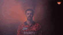 a man wearing a shirt that says kent on the front