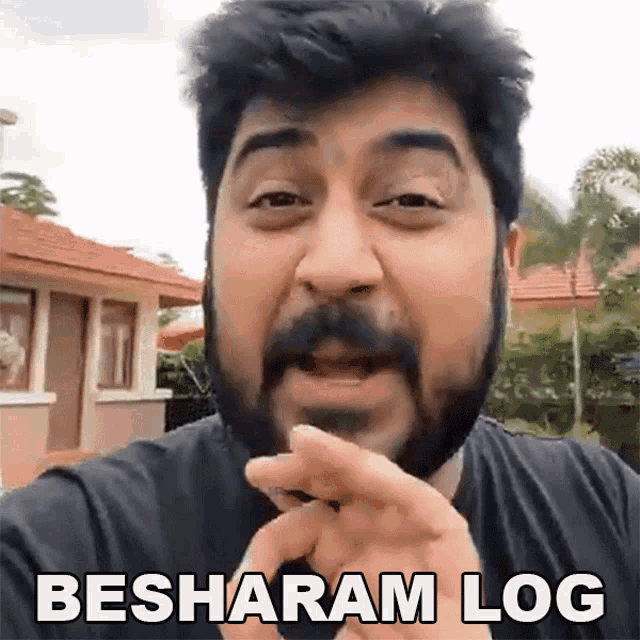 a man with a beard and mustache is making a funny face and says 