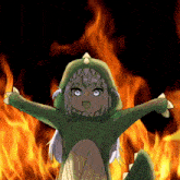 a girl in a green dinosaur costume is standing in front of a fire