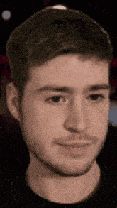 a close up of a man 's face with his eyes closed