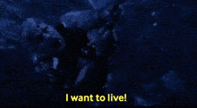 a man in the water with the words " i want to live " below him