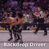 two wrestlers are fighting in a wrestling ring with the words backdrop driver below them