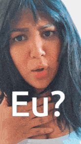 a woman with blue hair is holding her chest and says eu ?