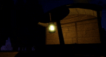 a lantern is lit up in the dark near a building