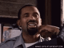 a man with a beard is smiling and making a funny face with the words make gifs at gifsoup.com