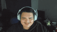 a man wearing headphones making a funny face