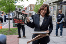 a woman holding a sign that says midnight memories on it