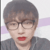 a close up of a person wearing glasses and headphones