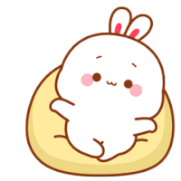 a cartoon rabbit is laying on a pillow with chinese writing behind it