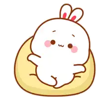a cartoon rabbit is laying on a pillow with chinese writing behind it