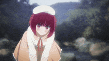a girl with red hair and a white hat is kneeling down