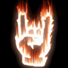 a flaming rock and roll sign with a skull in the middle