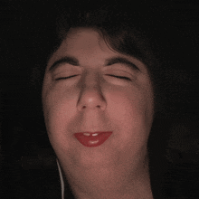 a close up of a person 's face with a funny face