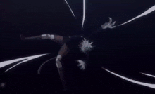 a close up of a person holding a sword in the dark .