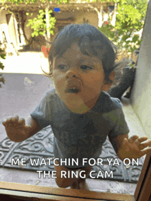 a baby is looking out a window with a caption that says " me watchin for ya on the ring cam "