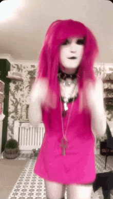 a girl with pink hair and a white face