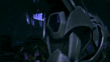 a dark room with a purple light coming out of the top