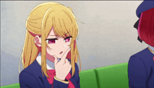 a girl with blonde hair and red eyes has her finger on her chin