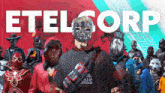 a group of people wearing masks are standing in front of the word etelcorp