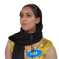 a woman wearing a black scarf and a yellow top has a name tag that says fiza