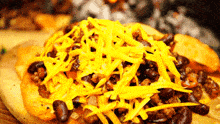 a close up of a pizza with cheese on top